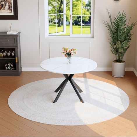 Table à manger ronde Ø 110 cm effet marbre blanc avec base noire en X, design moderne (1/5)