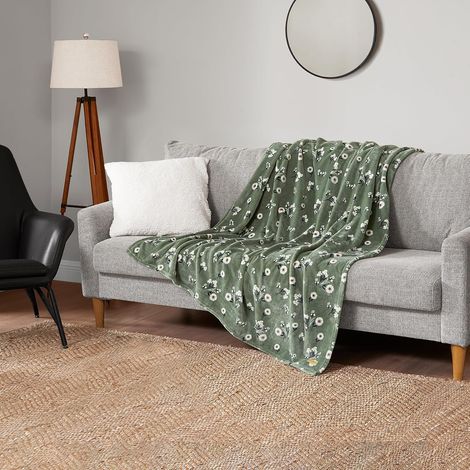 Couverture luxueuse en peluche - Un plaid en microfibre de haute qualité qui allie un confort somptueux à un style contemporain, mesurant 130 x 150 cm et présentant un motif floral vert pâquerette.