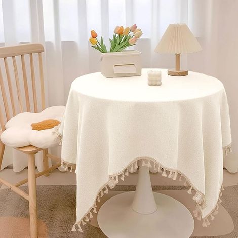 Mantel redondo de 120 cm, impermeable y lavable, confeccionado en una mezcla de algodón y lino con borlas, resistente a las manchas, ideal para mesas de centro y mesas de jardín. (1/5)
