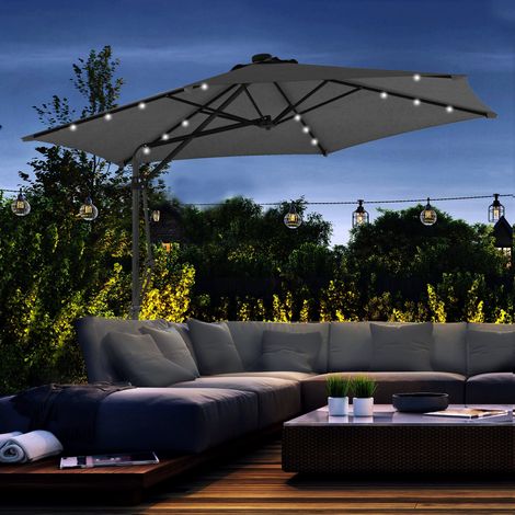 Ombrellone decentrato da 3 m con luci a LED, manovella e base a croce per patio e terrazza, grigio scuro.
