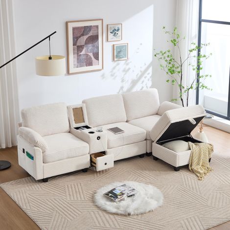 Grand canapé en velours côtelé, mousse confortable. Console centrale amovible, USB‑C, poche latérale, tiroir et pouf de rangement. Confort et fonctionnalité optimaux. (1/5)