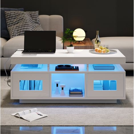 Table basse en panneaux de particules blancs brillants 100x50x43 cm avec LED RGB, prise et USB, rangement (1/5)