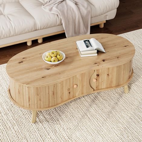 Couchtisch 108 x 50 x 37 cm in Kieselsteinform, mit 2 geriffelten Schiebetüren, Wohnzimmertisch mit Stauraum und Holzfüßen – Natur