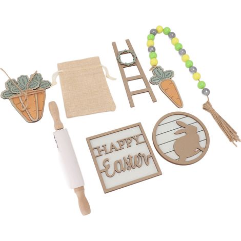 Plateau de Pâques à étages décoré avec lapin, carotte, ficelle de perles, rouleau à pâtisserie et échelle en bois.