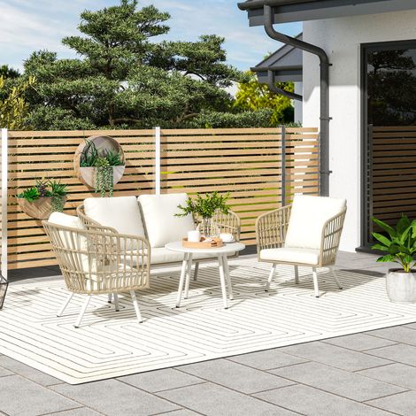 Ensemble de mobilier de jardin en polyrotin kaki. comprenant un canapé 2 places. un fauteuil. une table et des coussins. Résistant aux intempéries. pour 4 personnes.