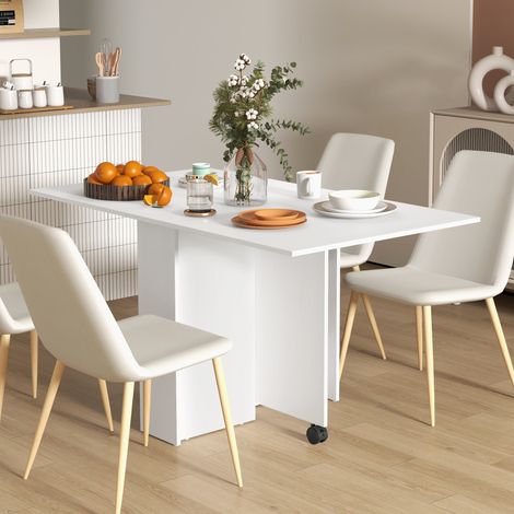 Table pliante design sur roulettes et étagères de rangement. Structure solide, couleur blanche, idéale pour petit intérieur