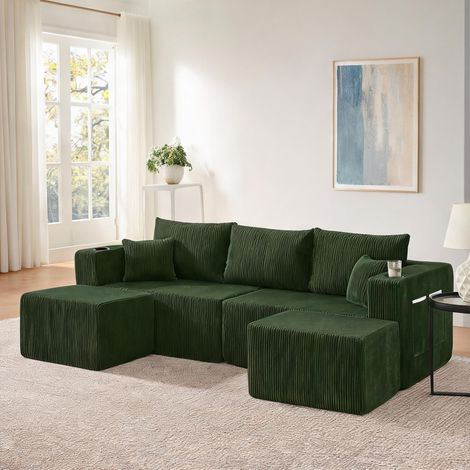 Canapé d'angle modulaire en tissu vert avec poufs en foam (1/5)