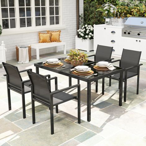 Table de jardin extérieure avec 4 chaises empilables. plateau en verre trempé 140 cm. noir
