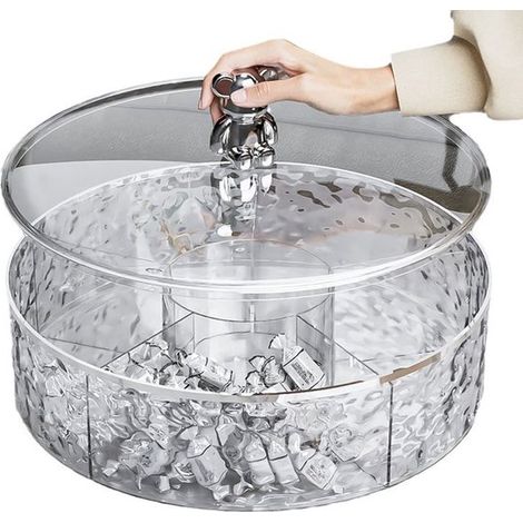 La table basse du salon est ornée d'un nouveau bol décoratif à fruits secs contenant divers fruits secs transparents. (1/4)