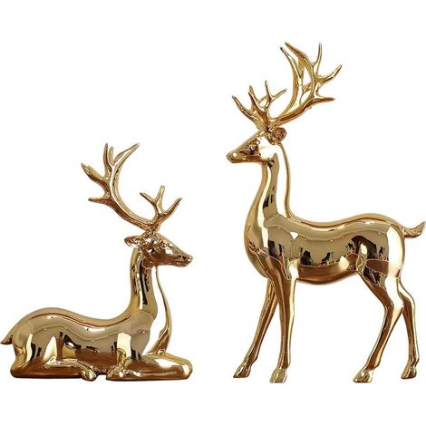 Ornamenti natalizi a forma di renna, ideali per decorazioni natalizie. Altezza della renna in piedi: 16,5 cm. Altezza della renna sdraiata: 11 cm. Confezione da 2 pezzi, colore oro.