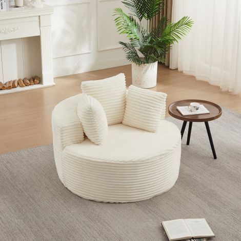 Poltrona rotonda in velluto a coste con un diametro di 110 cm: una poltrona comoda e informale, completa di tre cuscini decorativi e caratterizzata da un design minimalista. (1/5)