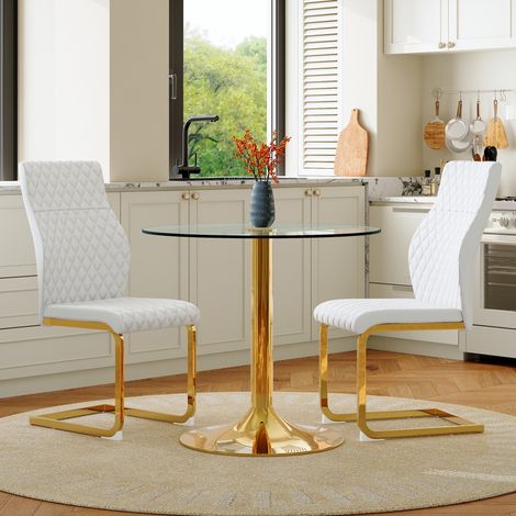 Ensemble repas table ronde verre trempé 85 cm diamètre, pieds métal doré, style chic premium, avec 2 chaises modernes blanches et dorées pour salle à manger. (1/5)