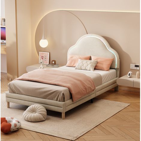 Cama tapizada de terciopelo beige 90x200 cm con cabecero en forma de nube, LED multicolor y somier de láminas (1/5)