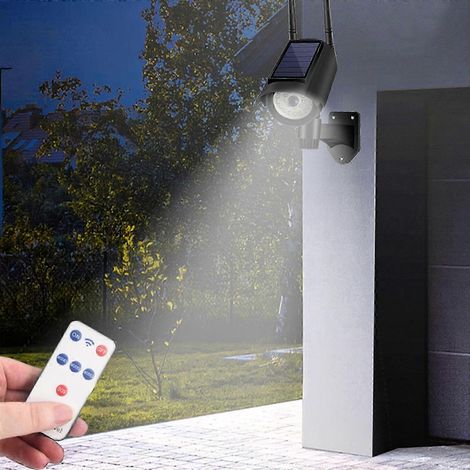 Lampe de sécurité YOBOLK avec détecteur de présence fausse caméra de sécurité et LED clignotante pour jardin et commerce. (1/4)