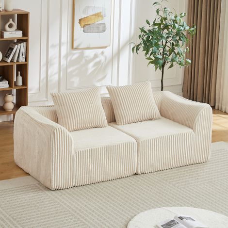Canapé deux places, avec deux coussins, style épuré, tissu velours rayé, lignes fluides, dossier légèrement incliné, couleur blanc cassé (1/5)