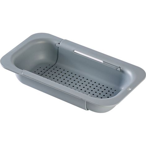 Cesta escurridora elástica para guardar platos en la encimera.