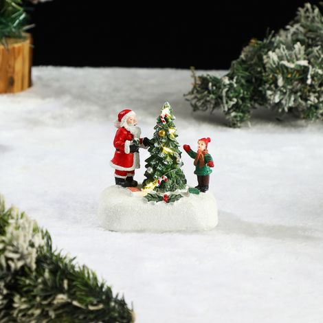 Décoration de Noël en résine représentant le père Noël, un enfant et un sapin lumineux idéale comme décoration de table festive (piles non incluses). (1/5)