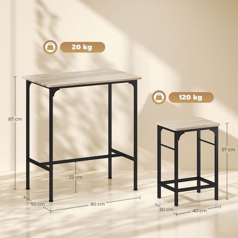 Un ensemble de mobilier de bar 3 pièces composé d'une table de cuisine en bois et acier et de deux tabourets de bar (en bois et noir). (1/5)