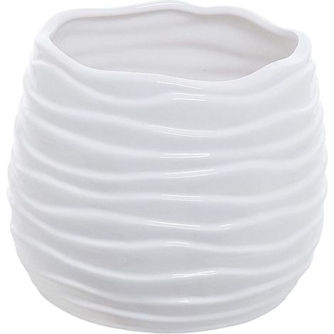 Modern ceramic flower pot in red, has a drainage hole and a wavy design. (1/5)