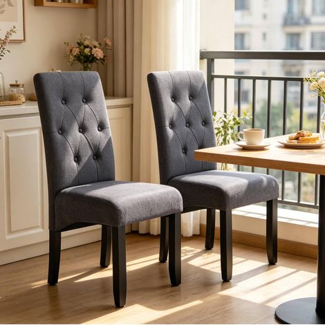 Set de 2 sillas de comedor acolchadas gris oscuro con respaldo alto y patas de madera (1/5)