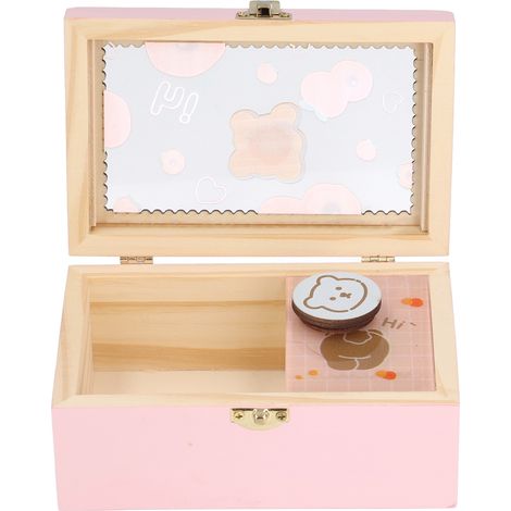Une boîte à bijoux pour fille, fiable, résistante, mignonne, spacieuse et décorée avec raffinement pour embellir sa chambre. Un ornement musical en forme d'ourson pêche.