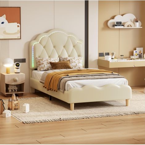 Letto bambini 90x200 cm imbottito con testiera ondulata, barre di protezione, LED, rete a doghe in legno, PU bianco (1/5)