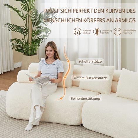 Un conjunto de sofá modular de dos piezas en color blanco crema, tapizado en chenilla, con un diseño curvo en forma de anacardo, sin bordes duros ni reposabrazos tiene un diseño suave y segmentado e i (1/5)