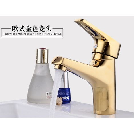 Robinet de lavabo professionnel en laiton doré, eau chaude et froide.