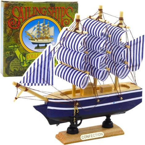 Modellino da collezione di veliero bianco e blu.