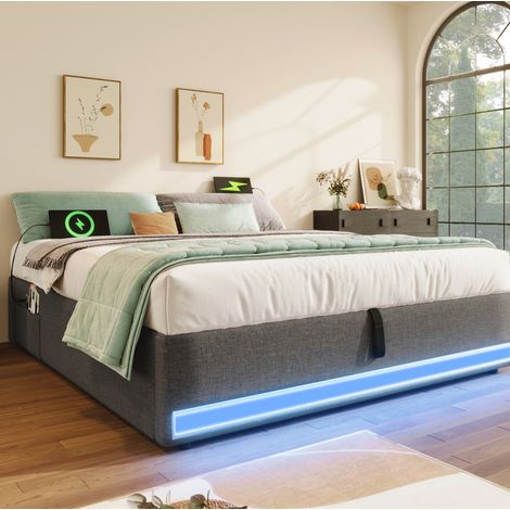 Cama tapizada moderna 140x200 cm de lino gris, con LED, USB y Type-C, arcón hidráulico y bolsillos laterales