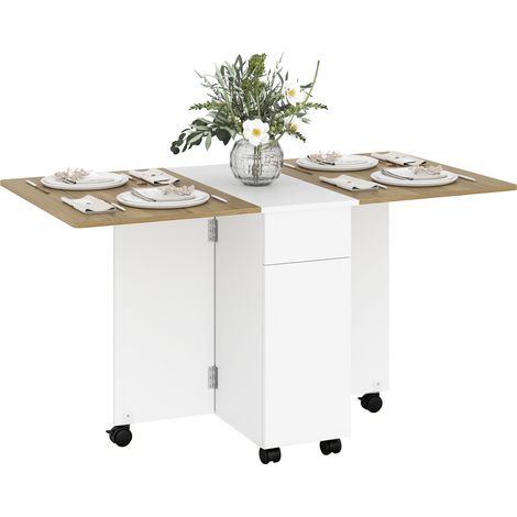 Table à manger pliable pour 6 personnes, table de cuisine sur roulettes avec 2 tiroirs 2 placards, 140x76x74cm, blanc (1/5)