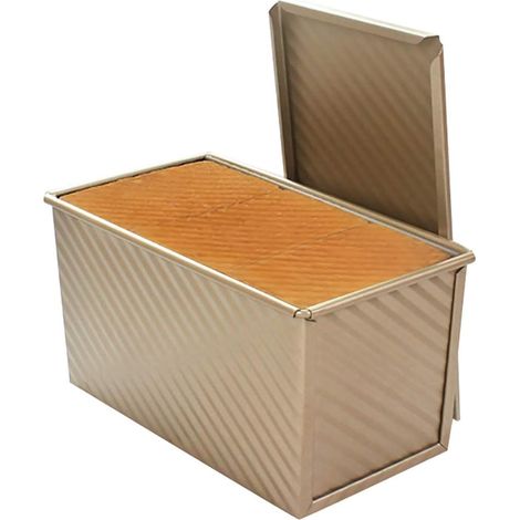 L'arme secrète du boulanger gourmet : moule à cake avec couvercle, surface ondulée antiadhésive pour une répartition uniforme de la chaleur, compatible four et lave-vaisselle.