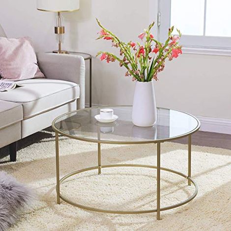 Table basse en verre avec structure en acier doré : Élégante et
