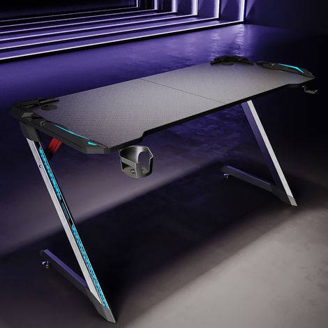 SIRHONA Gaming Desk RGB con LED - Progettato per Giocare, Nero 140x60x75cm Tavolo da Gioco con Portabicchieri e Gancio per Cuffie (1/5)