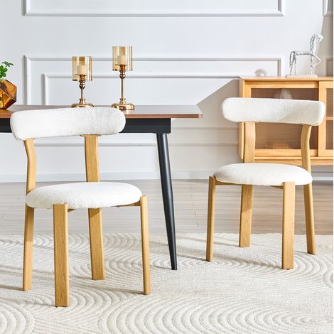 Set de 2 sillas de comedor blancas de tejido bouclé con respaldo ergonómico y patas de madera (1/5)