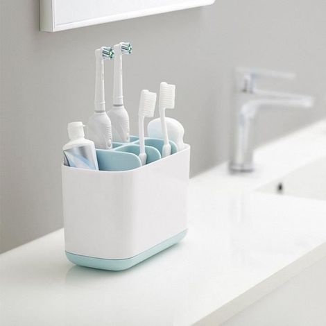 Porte-brosses à dents et tubes de dentifrice en plastique, marque, modèle, blanc et bleu clair, style contemporain. (1/4)