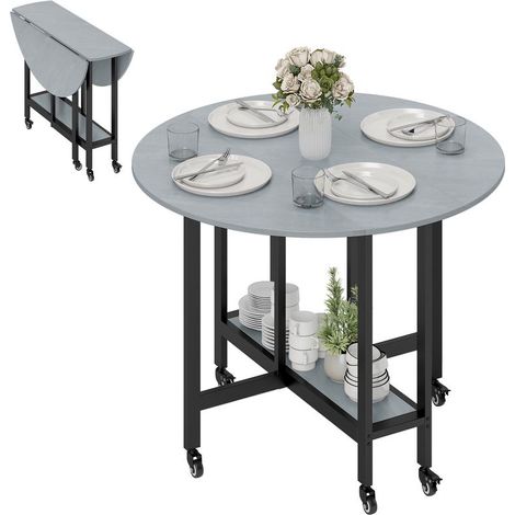 Table gris ciment pliante sur roulettes avec étagère ouverte, idéale petits espaces, design industriel pratique pour repas