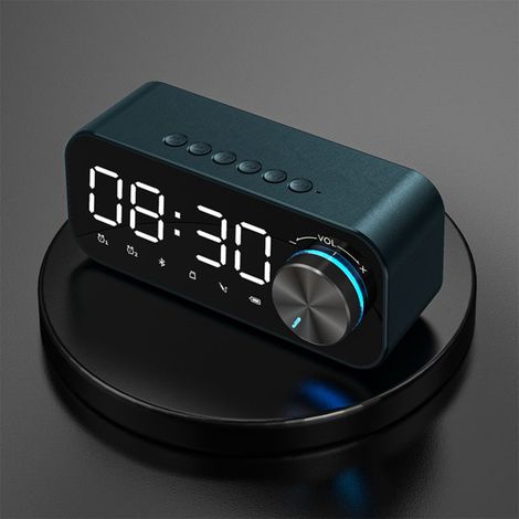 Radio-réveil numérique avec haut-parleur Bluetooth, affichage LED de l'heure et de l'alarme, et surface miroir pour bureau.