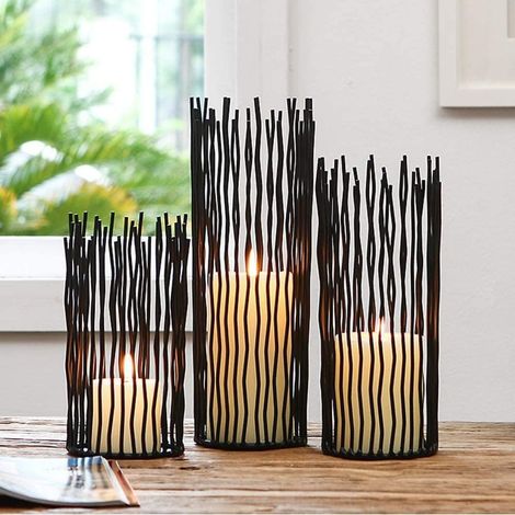 Set di 3 portacandele in metallo nero e tessuto, dal design moderno per interni ed esterni.