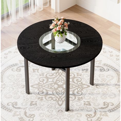 Mesa de comedor redonda Ø 100 cm negra con inserto de vidrio y estante (1/5)