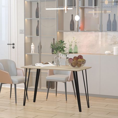 Esstisch im Industriedesign mit einer großen Tischplatte von 120 cm (L) x 60 cm (B) x 75 cm (H), schwarzen Haarnadelbeinen aus Metall und hellem MDF in Eichenoptik.