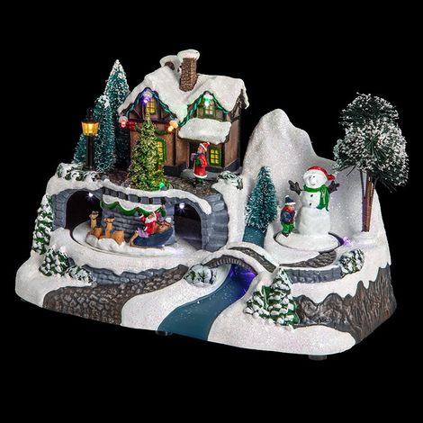 Fééric Lights And Christmas – Maison de Noël lumineuse avec Père Noël et bonhomme de neige – Décoration festive 24x15cm – Éclairage LED à piles – PVC et poliresina