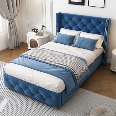 Letto imbottito classico 90x200 cm in velluto blu con testiera capitonné, rete a doghe e dettagli con borchie (1/5)