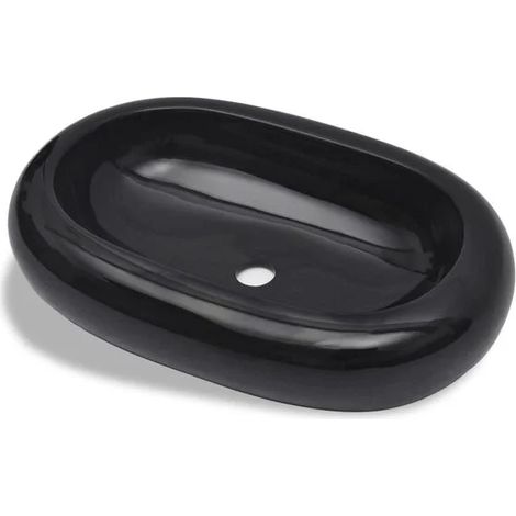 Lavabo ovale en céramique noire, adapté à une utilisation dans une salle de bains.