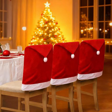 4 Housses de chaise de Noël - Lot de 4 housses de chaise à motif chapeau de Père Noël rouge - Housses de dossier de chaise de cuisine de Noël avec 4 porte-couverts pour décoration d'intérieur de fête (1/4)