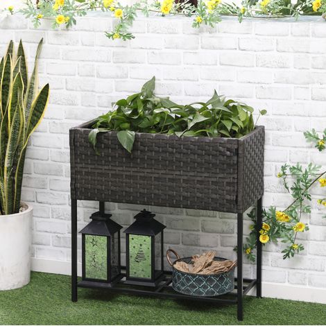 Fioriera rialzata in polyrattan con gambe e ripiano, marrone DESVIAE (1/5)