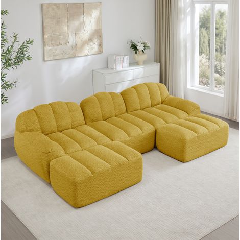 Divano modulare in tessuto fleece granulato giallo, componibile a U o L, con pouf abbinabile (1/5)