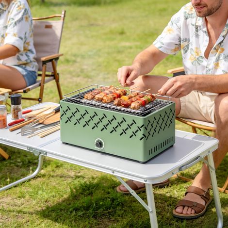 Barbacoa portátil de carbón con ventilador incorporado para uso exterior, color verde claro.