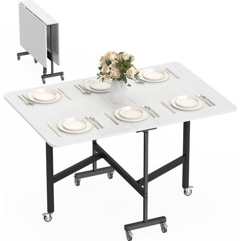 Table pliante pour 4 à 6 personnes avec 2 abattants et roulettes avec frein. 120x80x73 cm. Blanc bois.