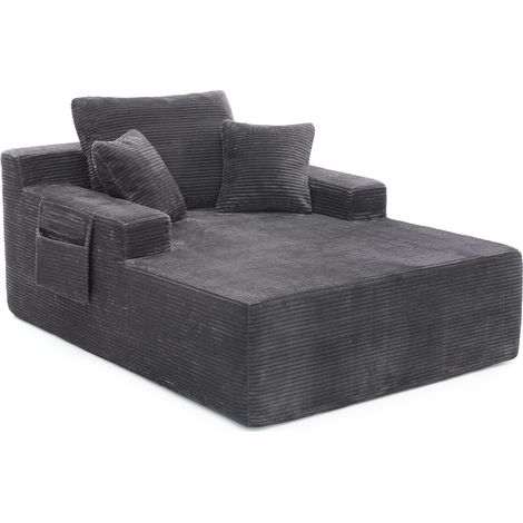 Sofá compacto de pana gris oscuro con bolsillos laterales, cojines suaves y asiento acolchado (1/5)